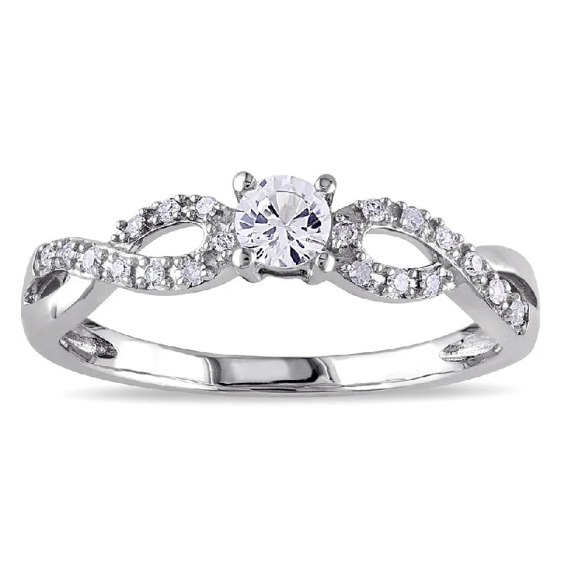 Miadora 10k White Gold Created White Sapphire and 1/10ct TDW Diamond Crossover Engagement Ring (H-I,